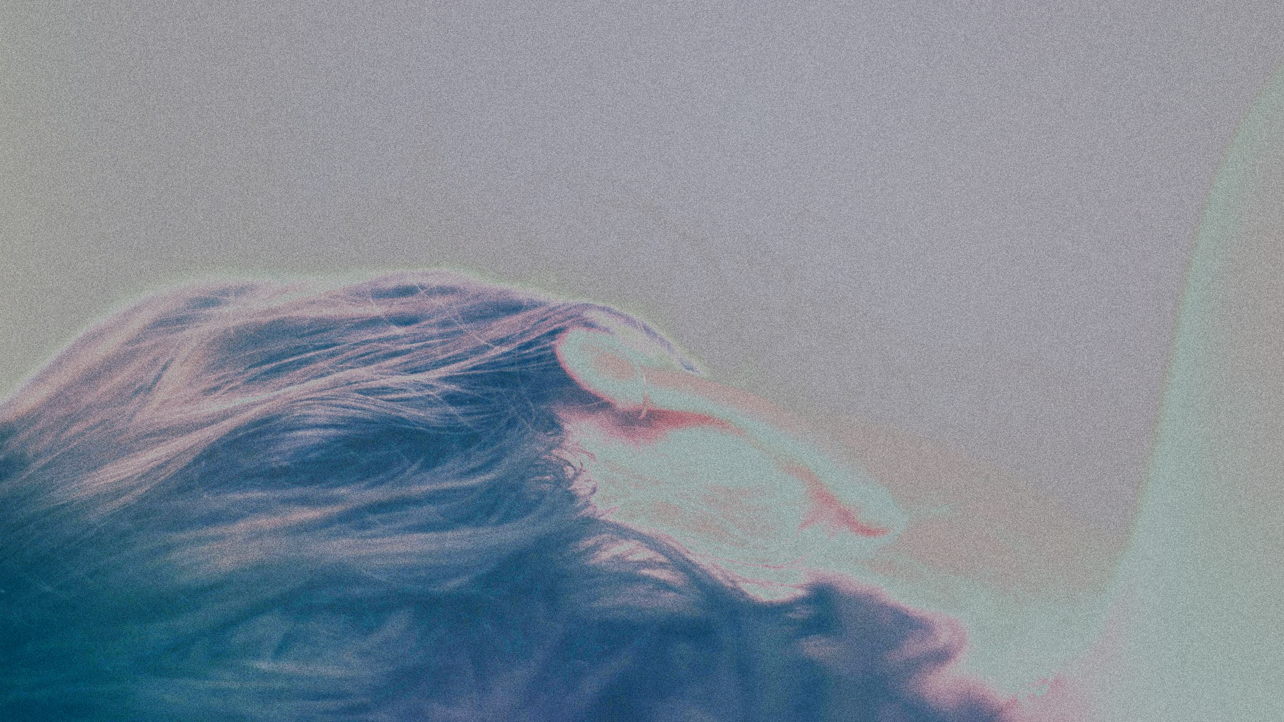 #An abstract close-up image of a person’s head resting, with soft lighting and gentle hues, symbolizing relaxation and peacefulness